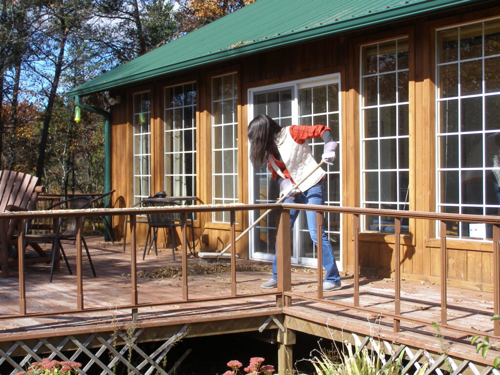 Sweeping leaves off the deck